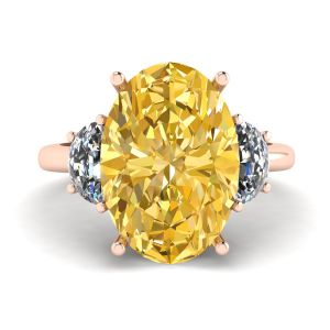 Ovaler gelber Diamant mit seitlichen halbmondförmigen weißen Diamanten in Roségold